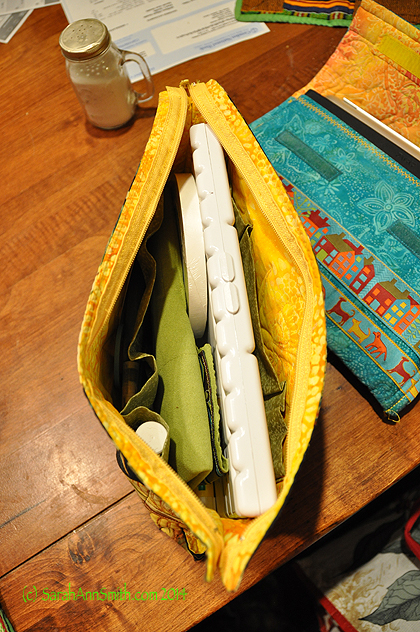 Inside of my Painting stuff bag.  It has pockets sized to fit a tube of gouache, a glue stick, eraser, and so on.