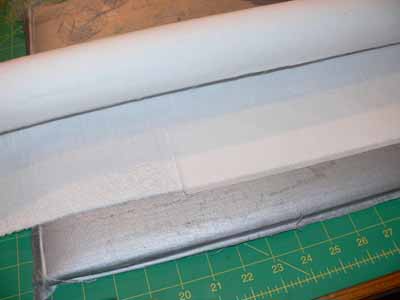 Fusing Misty Fuse to the edge of the tube-wrap-cloth