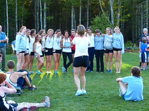 Coach Becky taking a picture of first place girls' team