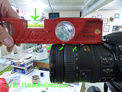 Using the bubble level on the top of the lens is a challenge because of the grip and changes in the surface.