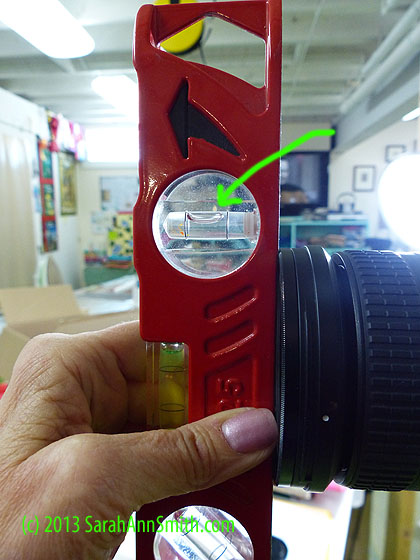 use  your Torpedo or other level to make sure the front of the lens is vertical.  A larger level such as this one is likely to have a bit better accuracy than a small one like the hotshoe level.  It also means I don't have to jar the camera taking the hotshoe level in and out of the hotshoe!