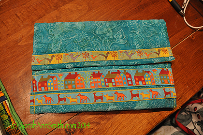 The iPad case is simply a larger version of the card holder.  The trim comes from Renaissance Ribbons. 