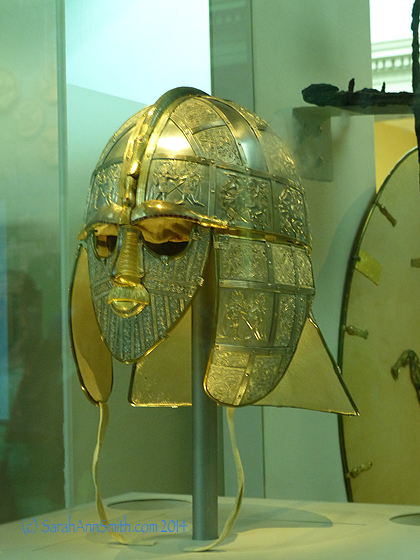 Based on the fragments and knowledge about contemporary helmets and design, they have made this piece to show what it would have looked like at the time of burial, including the garnets on the eyebrow ridges.  Simply phenomenal artistry and craftsmanship.