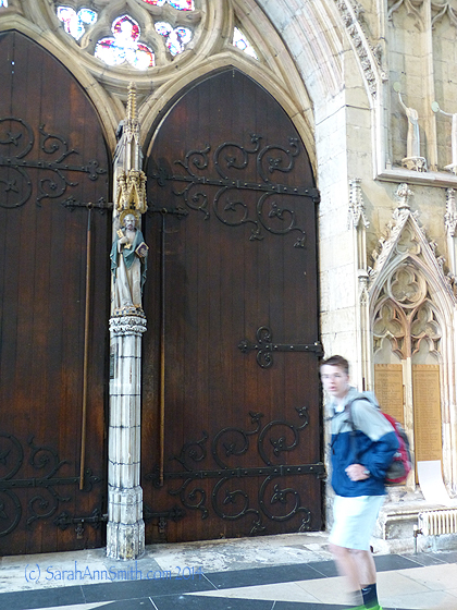 The inside of the big doors on the West face of the Minster and Eli, not so happy that I'm taking yet another  photo of him.  That's what moms do, kiddo!