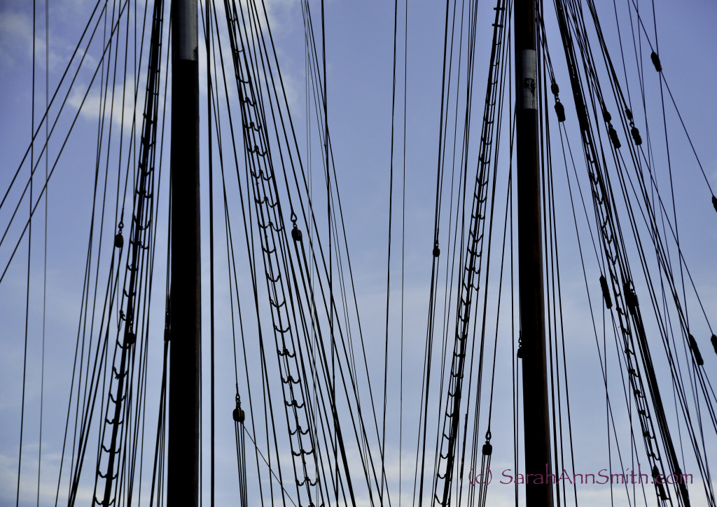 adjusted levels to darken the masts, smart sharpen.  Lightened the sky by adjusting the blues slightly.  Slightly cropped on the right. The Bluenose II, a replica of the Bluenose which is on the back of the Canadian dime.  Lunenburg, Nova Scotia.  I liked the play of lines across the image.