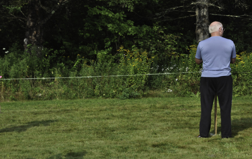 Waiting for the runners at a cross country meet.  Increased contrast a tad, cropped off a bit on the bottom, lasso and content aware fill to remove a sliver of a person on the far right.