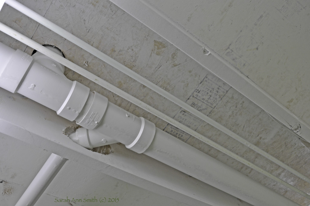 Ceiling of my basement studio:  primed joists and underside of the upstairs sub-flooring