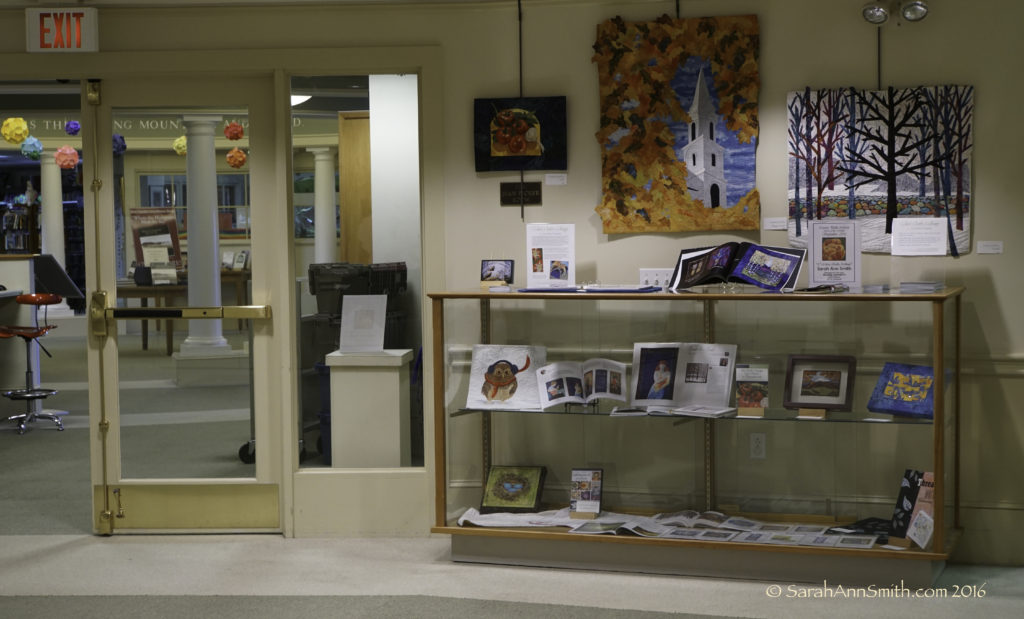 Between the entrance and the mini kitchen area, is a cabinet with a bit of wall.