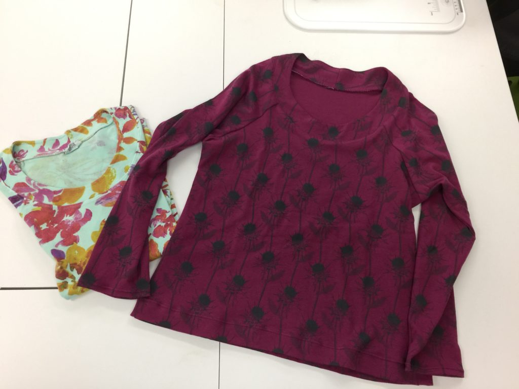 Success!  I actually made a KNIT garment.  The original shirt (purchased) is on the left. After making the pattern from that shirt, I made the plum one on the right.  I'll do a separate blogpost later this week with more info on how I did it and which stitches used.