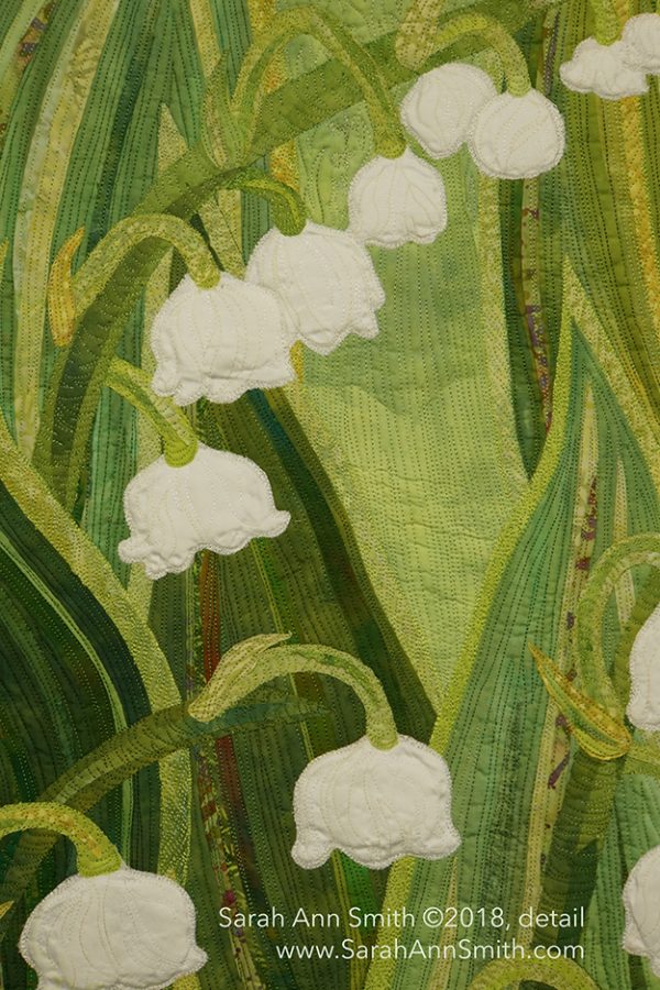 Sarah Ann Smith's Lilies of the Valley art quilt features small white flowers against a field of green 